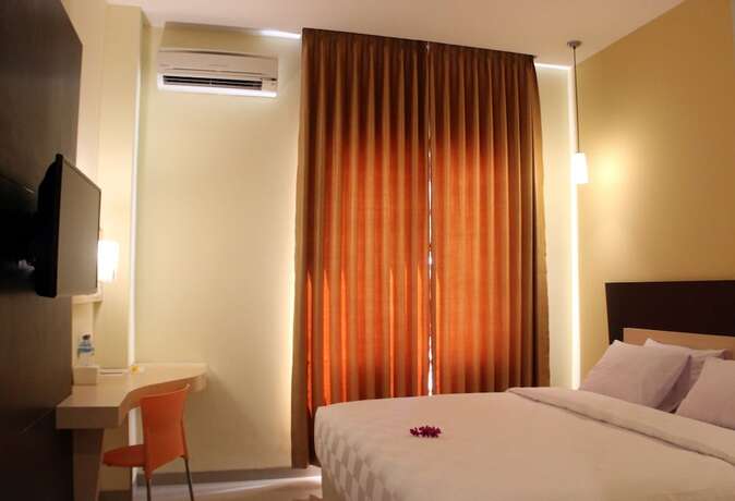 Imagen de la habitación del Hotel M, Cakranegara Utara. Foto 8