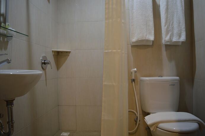 Imagen de la habitación del Hotel M, Cakranegara Utara. Foto 13