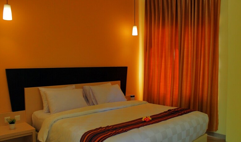 Imagen de la habitación del Hotel M, Cakranegara Utara. Foto 17