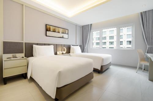 Imagen de la habitación del Hotel M City Saigon. Foto 3