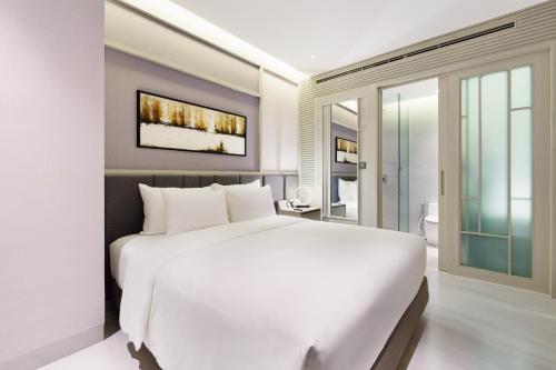 Imagen de la habitación del Hotel M City Saigon. Foto 4