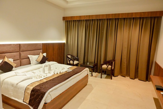 Imagen de la habitación del Hotel M D Farms And Resorts. Foto 4