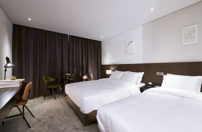 Imagen de la habitación del Hotel M Felice. Foto 15