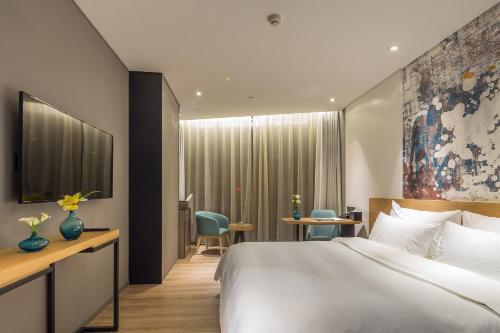 Imagen general del Hotel M Hotel Zhengzhou. Foto 4