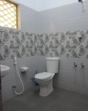 Imagen de la habitación del Hotel M R Beach and Cottages. Foto 11