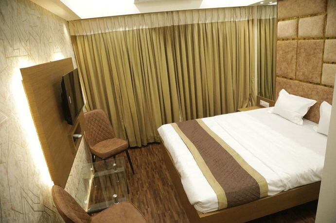 Imagen de la habitación del Hotel M Residency. Foto 7