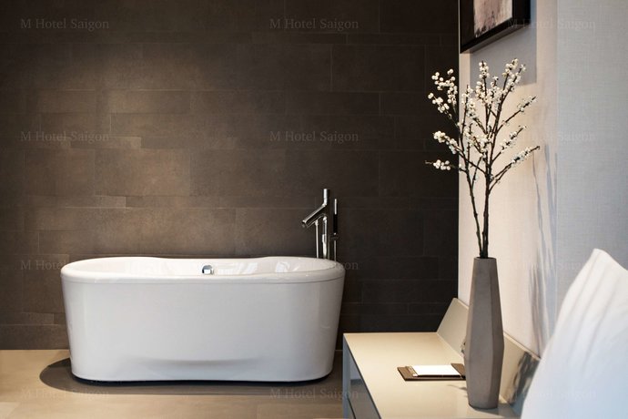 Imagen de la habitación del Hotel M Saigon. Foto 10