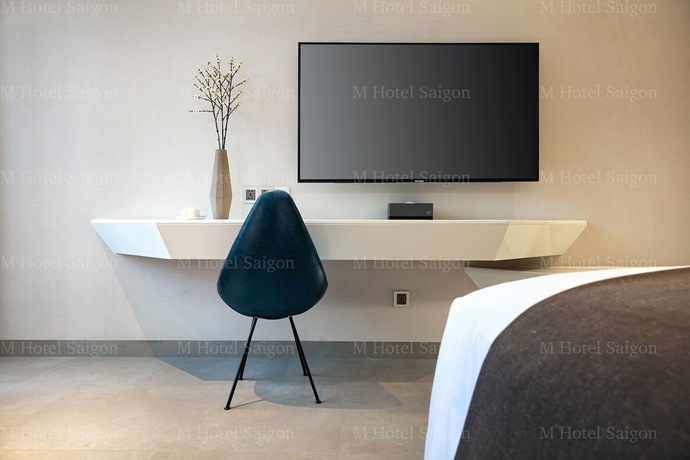 Imagen de la habitación del Hotel M Saigon. Foto 16