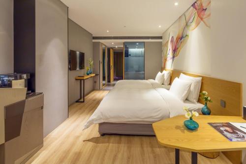 Imagen de la habitación del Hotel M Zhengzhou. Foto 16