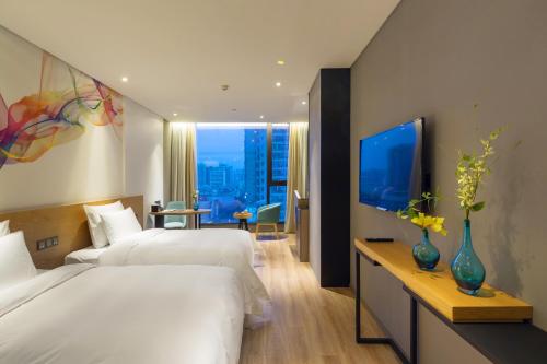 Imagen de la habitación del Hotel M Zhengzhou. Foto 17