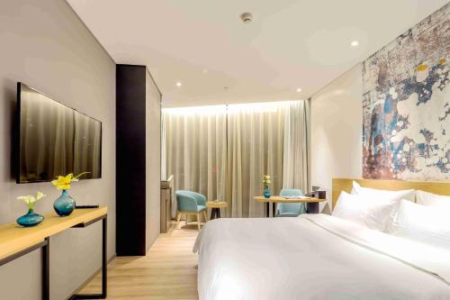 Imagen de la habitación del Hotel M Zhengzhou. Foto 18