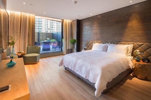 Imagen de la habitación del Hotel M Zhengzhou. Foto 20