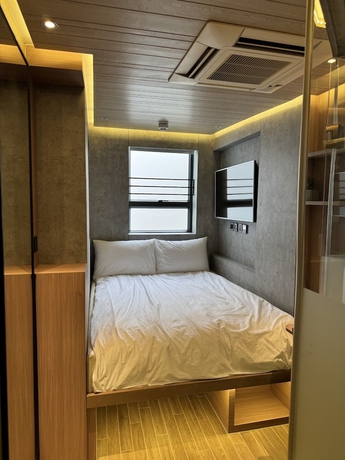 Imagen de la habitación del Hotel M plus. Foto 13