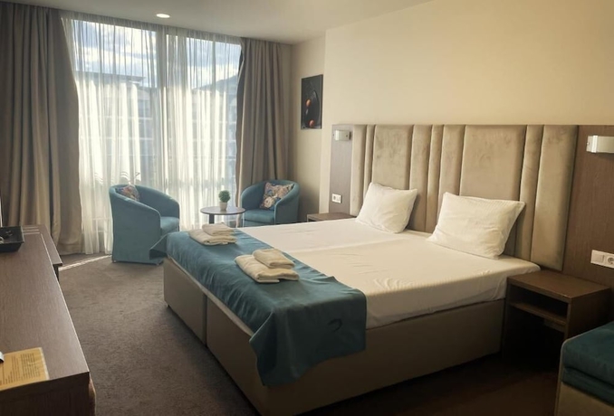 Imagen de la habitación del Hotel MAGNIFIC. Foto 4