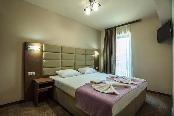 Imagen de la habitación del Hotel MAGNIFIC. Foto 8