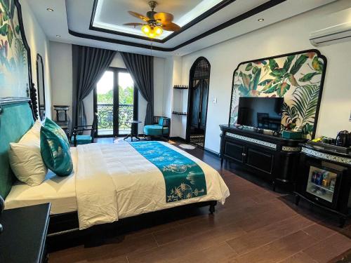 Imagen de la habitación del Hotel MAISON CAMELLIA. Foto 16