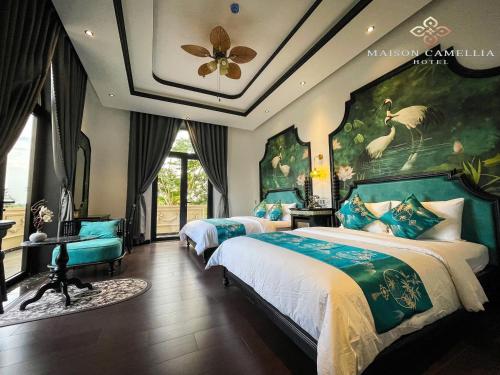 Imagen de la habitación del Hotel MAISON CAMELLIA. Foto 18