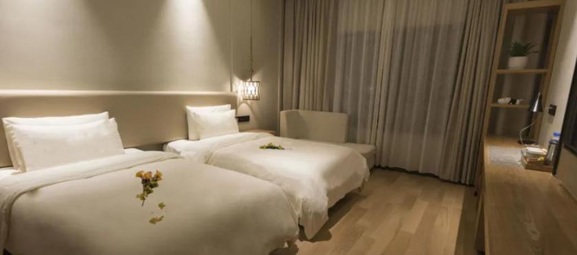 Imagen de la habitación del Hotel MANJU HOTEL (JIANGNAN YIBU). Foto 8