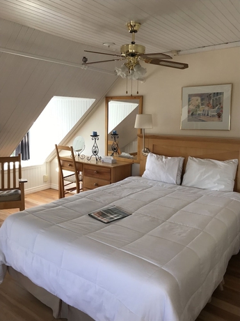 Imagen de la habitación del Hotel MANOIR CHARLEVOIX. Foto 7