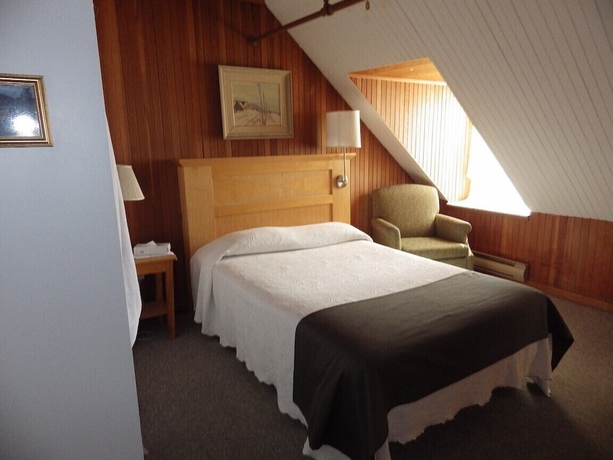 Imagen de la habitación del Hotel MANOIR CHARLEVOIX. Foto 9
