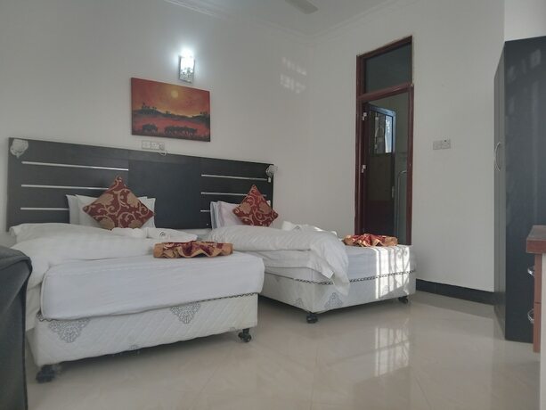 Imagen de la habitación del Hotel MARKDON VILLAGE HOTEL. Foto 10