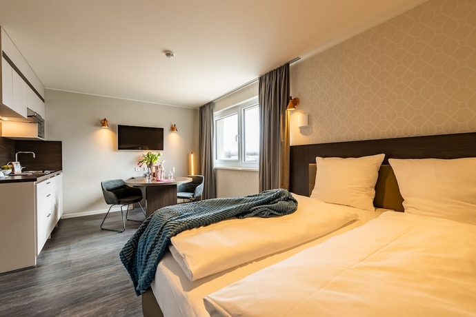 Imagen de la habitación del Hotel MASEVEN München Messe Dornach. Foto 6