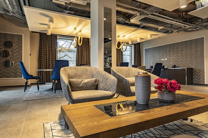 Imagen del bar/restaurante del Hotel MASEVEN München Messe Dornach. Foto 2