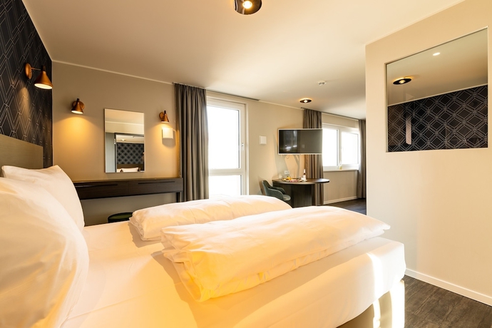 Imagen de la habitación del Hotel MASEVEN München Messe Dornach. Foto 10