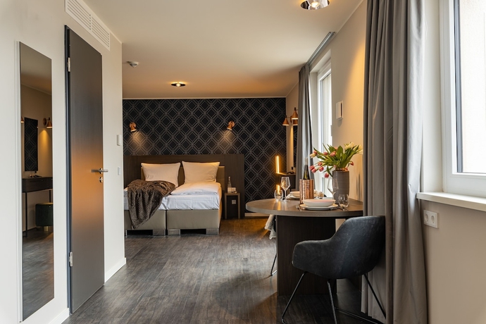 Imagen de la habitación del Hotel MASEVEN München Messe Dornach. Foto 14