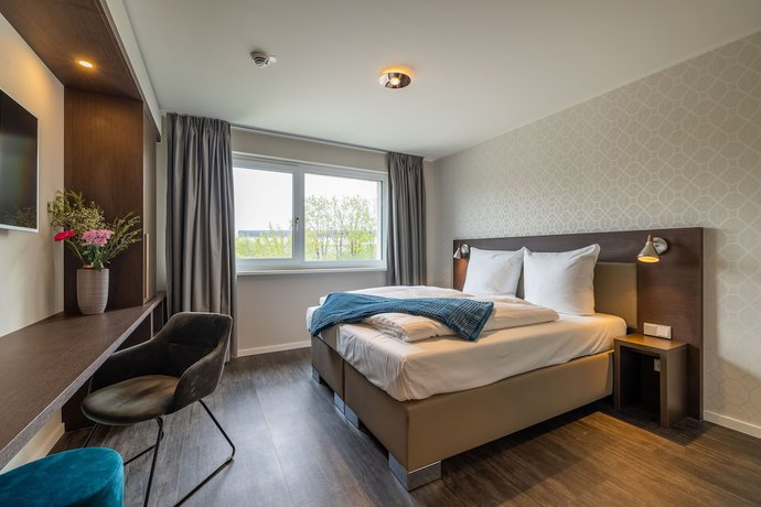 Imagen de la habitación del Hotel MASEVEN München Messe Trudering. Foto 6