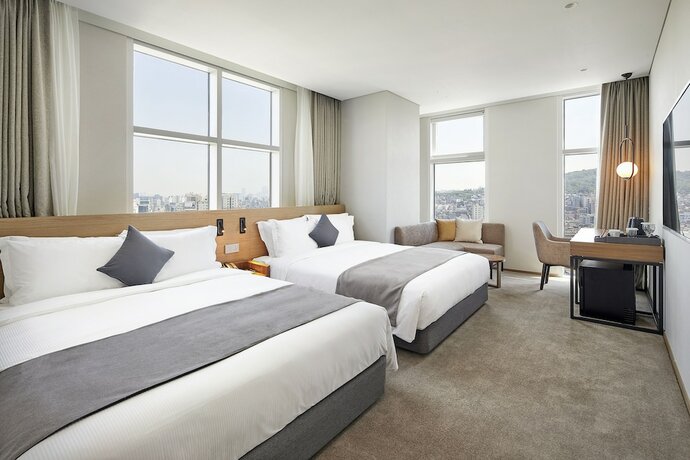 Imagen de la habitación del Hotel MD Doksan. Foto 12