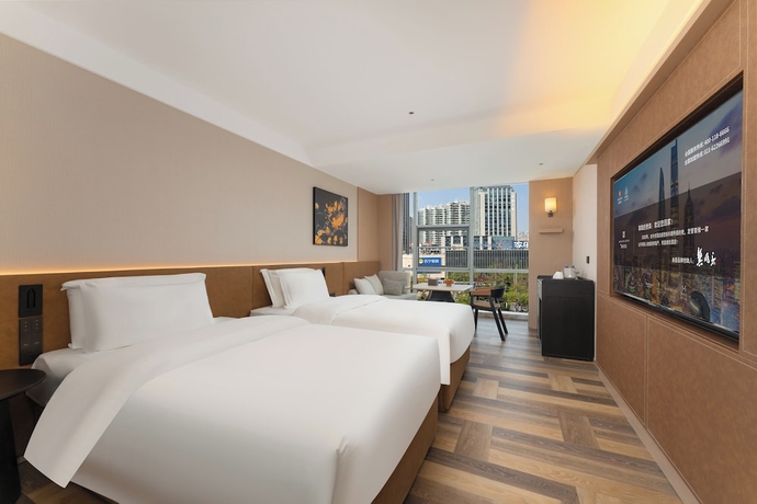 Imagen de la habitación del Hotel MEHOOD LESTIE Qingdao Vientiane. Foto 10