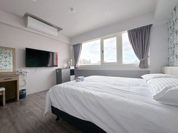 Imagen de la habitación del Hotel MENG JING HOTEL. Foto 12