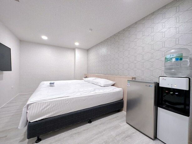 Imagen de la habitación del Hotel MENG JING HOTEL. Foto 20
