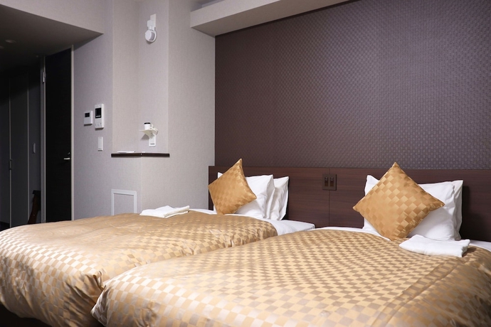 Imagen de la habitación del Hotel MERBABU STAY OSAKA. Foto 13