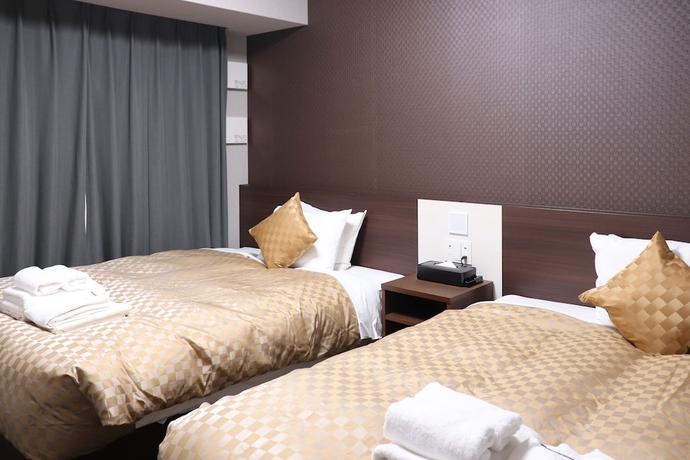Imagen de la habitación del Hotel MERBABU STAY OSAKA. Foto 16