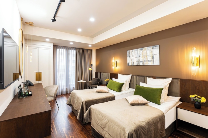 Imagen de la habitación del Hotel METROPOL Club House. Foto 7