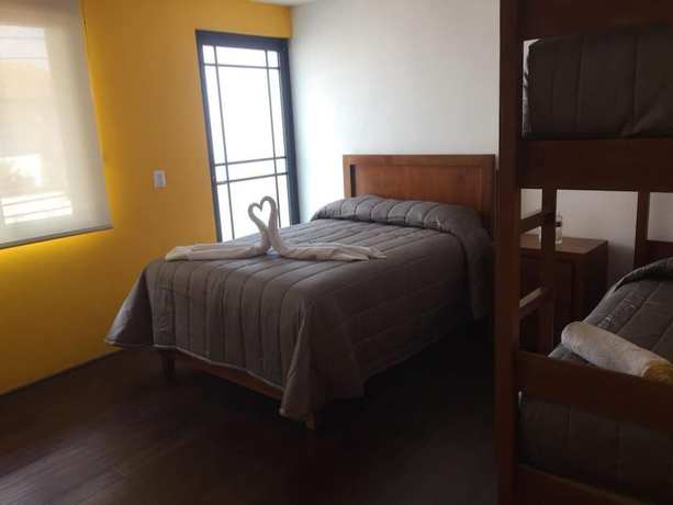 Imagen de la habitación del Hotel MH. Foto 12