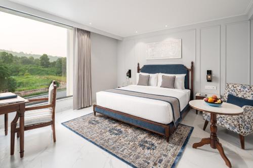 Imagen de la habitación del Hotel MJ Sarovar Portico Haridwar. Foto 11