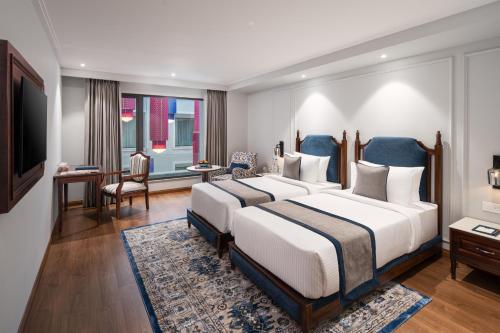 Imagen de la habitación del Hotel MJ Sarovar Portico Haridwar. Foto 12