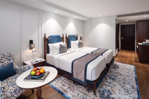 Imagen de la habitación del Hotel MJ Sarovar Portico Haridwar. Foto 14