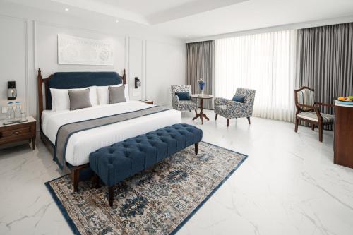 Imagen de la habitación del Hotel MJ Sarovar Portico Haridwar. Foto 16
