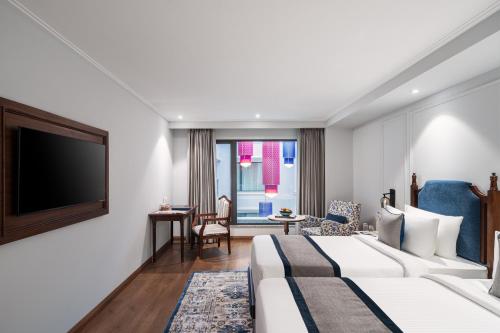 Imagen de la habitación del Hotel MJ Sarovar Portico Haridwar. Foto 19