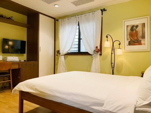 Imagen de la habitación del Hotel MOO TIME INN. Foto 4
