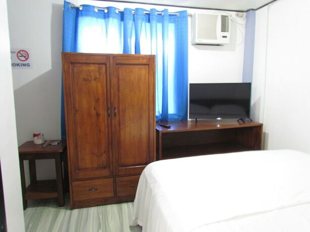 Imagen de la habitación del Hotel MOPE Beach Resort. Foto 11