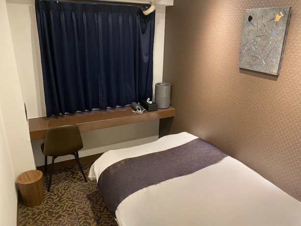 Imagen de la habitación del Hotel MUST WIN HOTEL. Foto 8