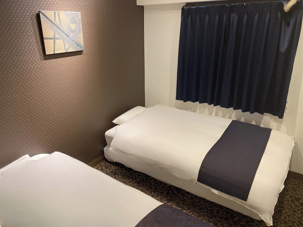 Imagen de la habitación del Hotel MUST WIN HOTEL. Foto 10