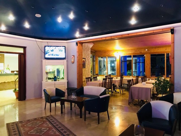 Imagen del bar/restaurante del Hotel MV HOTEL. Foto 4