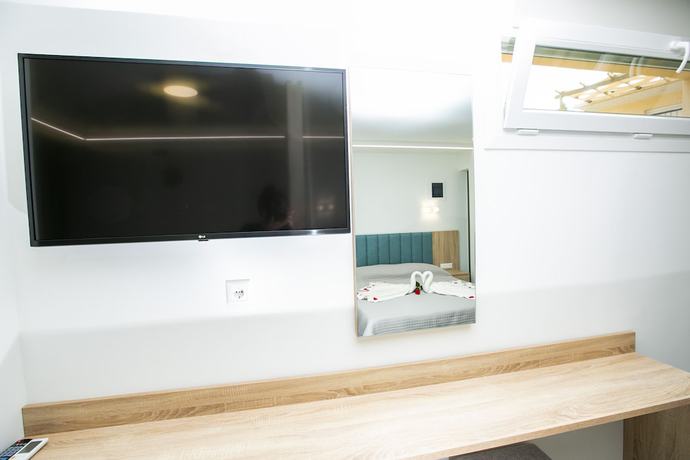 Imagen de la habitación del Hotel MYTHOS BUNGALOWS. Foto 11