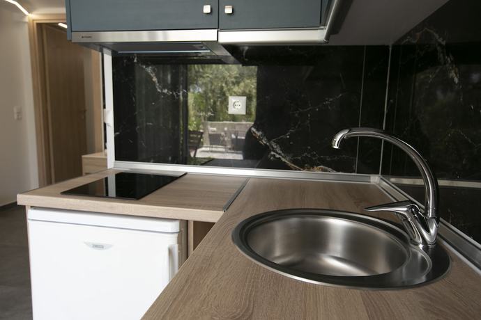 Imagen de la habitación del Hotel MYTHOS BUNGALOWS. Foto 12